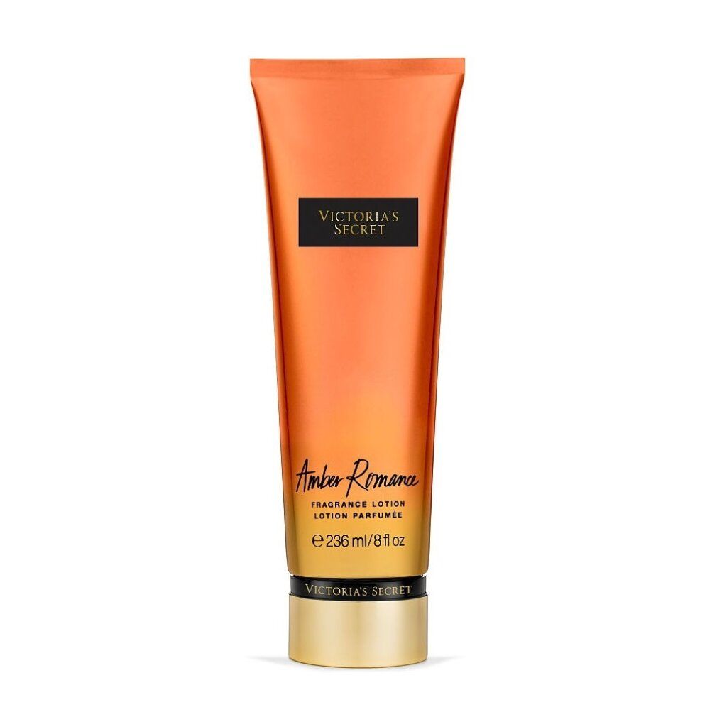 Körperlotion Victoria's Secret Amber Romance. Orangefarbene Tube mit schwarzem Etikett. Produktname und Marke sind sichtbar.