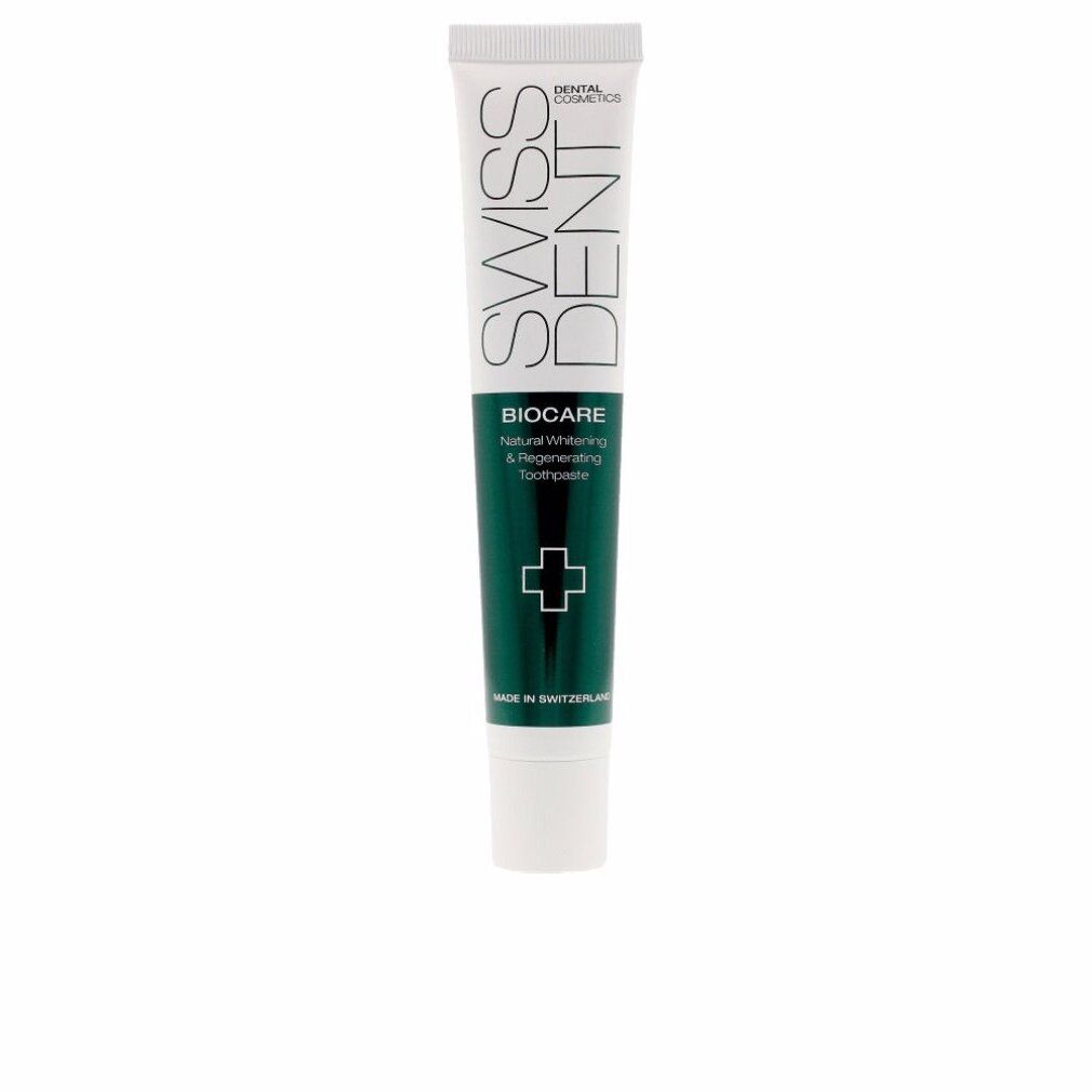 Zahncreme-Tube mit grünem Streifen und Kreuz-Symbol. Schriftzug: SWISSDENT, BIOCARE, Natural Whitening & Regenerating Toothpaste.