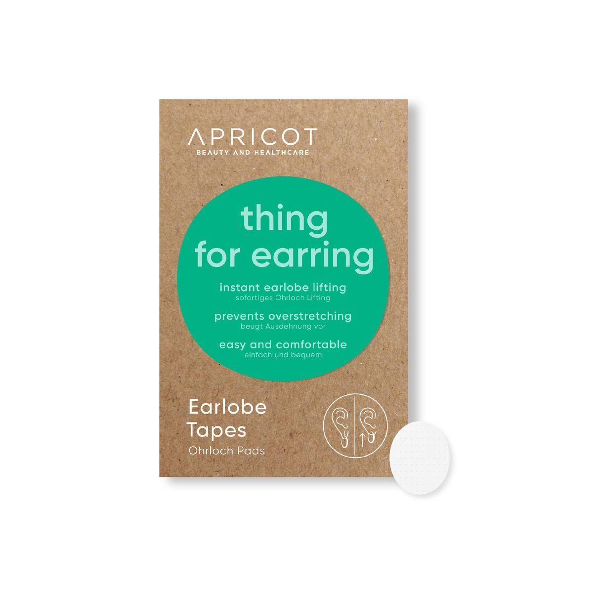 Kartonverpackung mit Produktbeschriftung. Aufschrift: APRICOT, thing for earring, Ohrloch Tapes. Ein einzelnes, rundes Tape daneben.