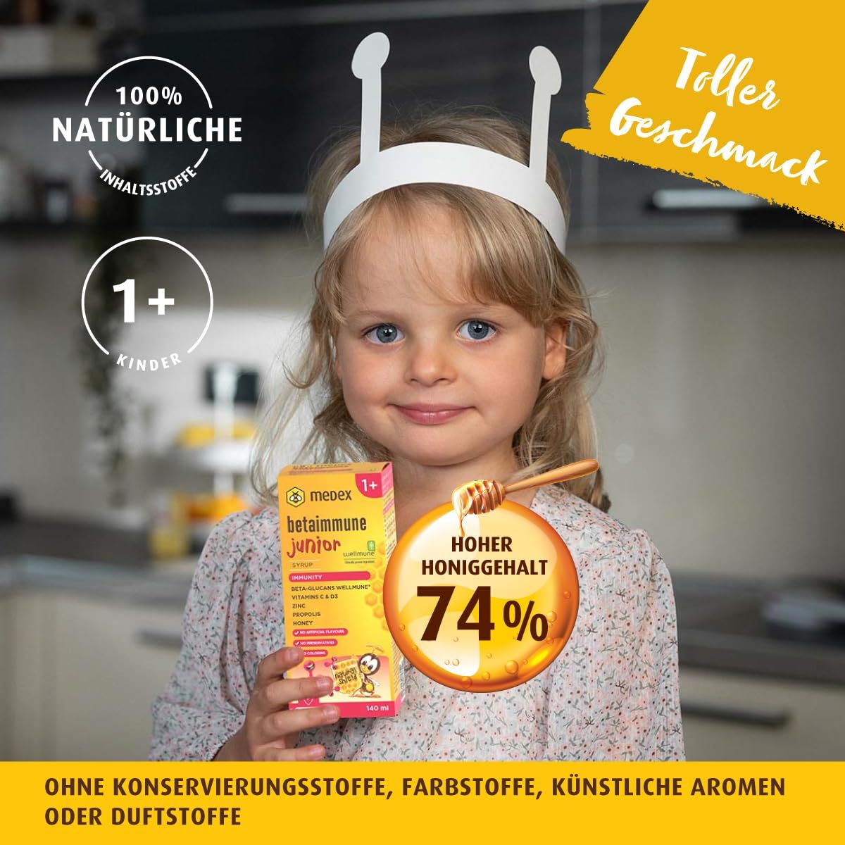 Kind hält Medex BetaImmune Junior Sirup-Packung. Auf der Packung: 1+ Kinder, 100% natürliche Inhaltsstoffe, hoher Honiggehalt 74%.