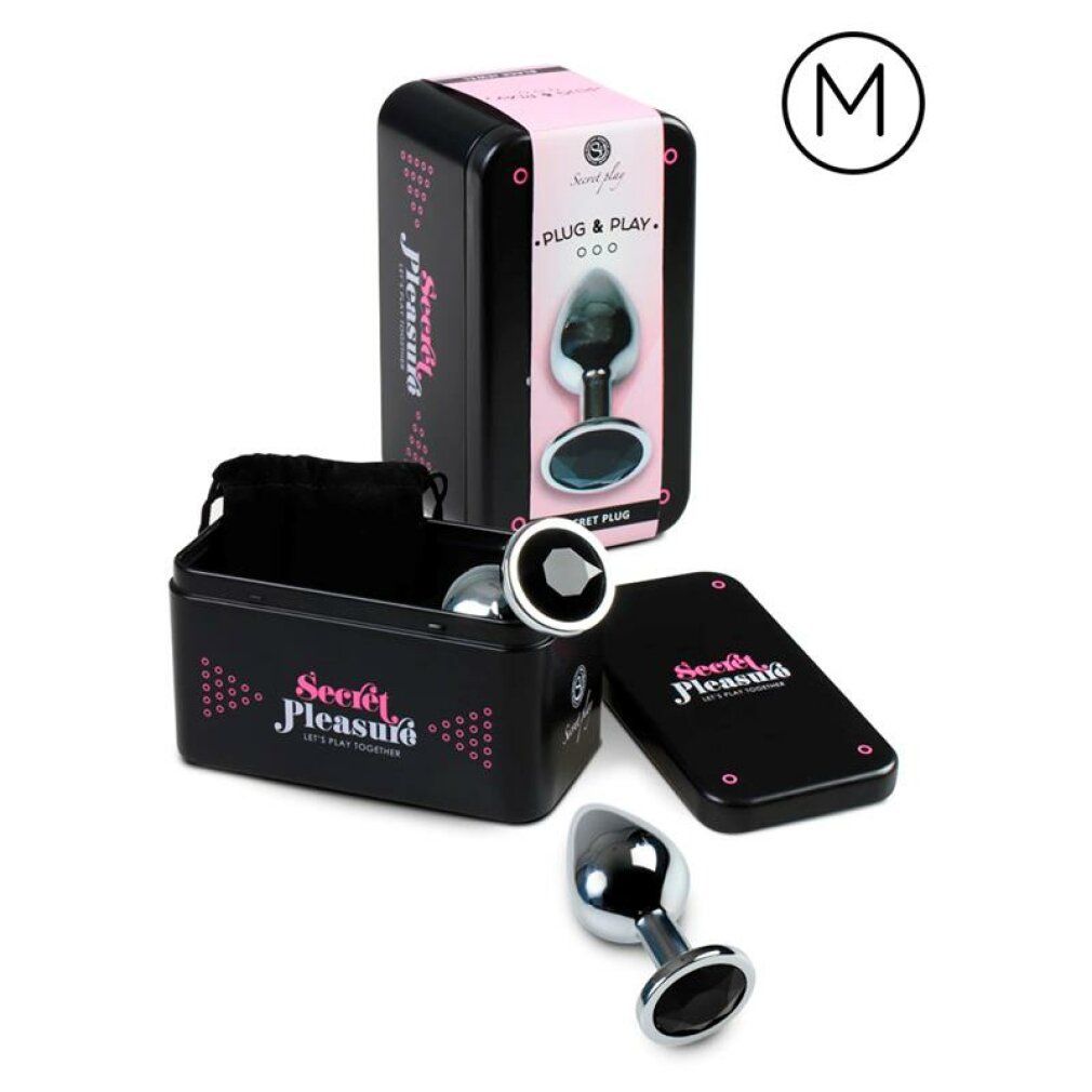 Produktverpackung. Schwarze Dose mit Analplug, schwarzem Beutel und Deckel. Rosa Akzente und Schriftzug.