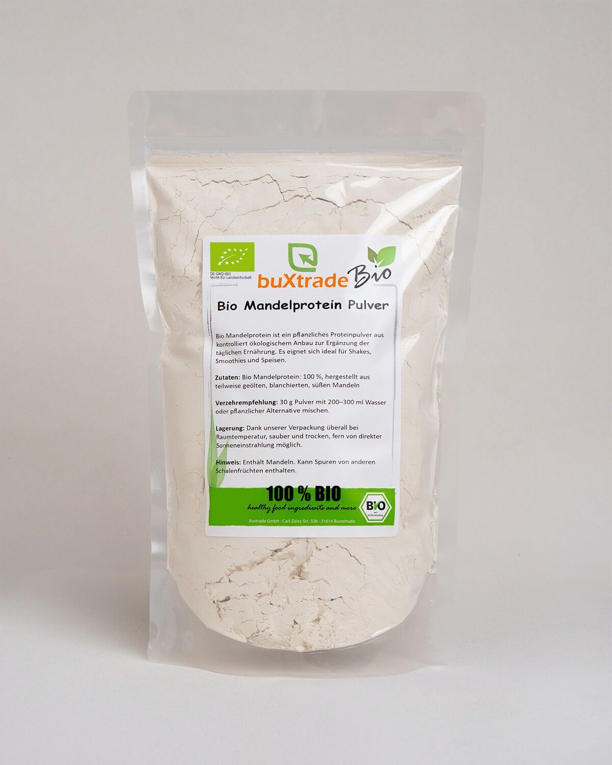 Verpackung mit buXtrade Bio Mandelprotein Pulver. Enthält 100% Bio-Mandelprotein.