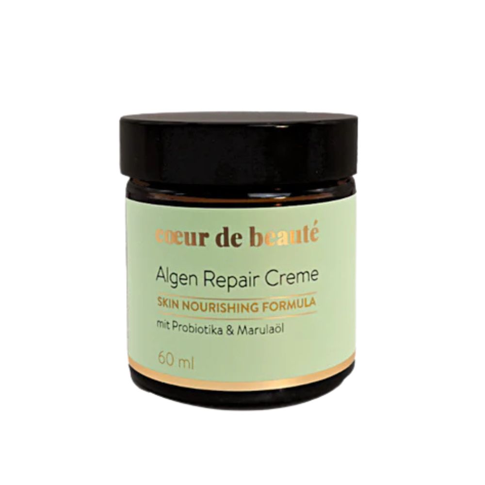Creme-Glas mit schwarzem Deckel. Aufschrift: Coeur de beauté, Algen Repair Creme, Skin Nourishing Formula, mit Probiotika & Marulaöl, 60 ml.