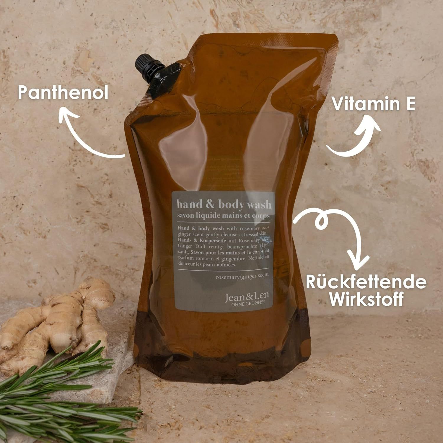 Braune Nachfüllpackung Hand & Body Wash. Text: Rosemary/Ginger Scent, 1500 ml. Pfeile zeigen auf Inhaltsstoffe: Panthenol, Vitamin E.
