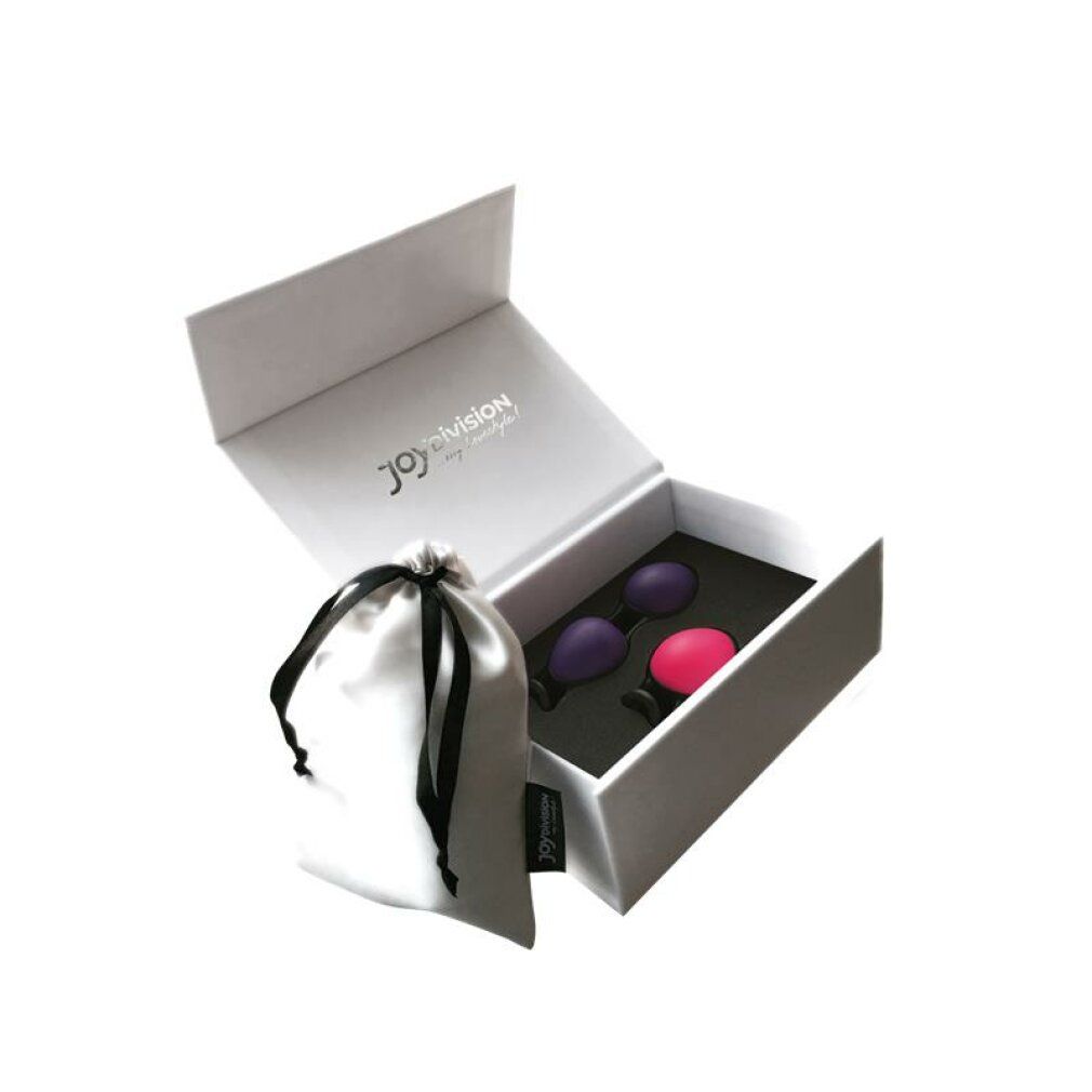 Geöffnete Box mit zwei Joyballs (lila, pink) und einem Beutel.
