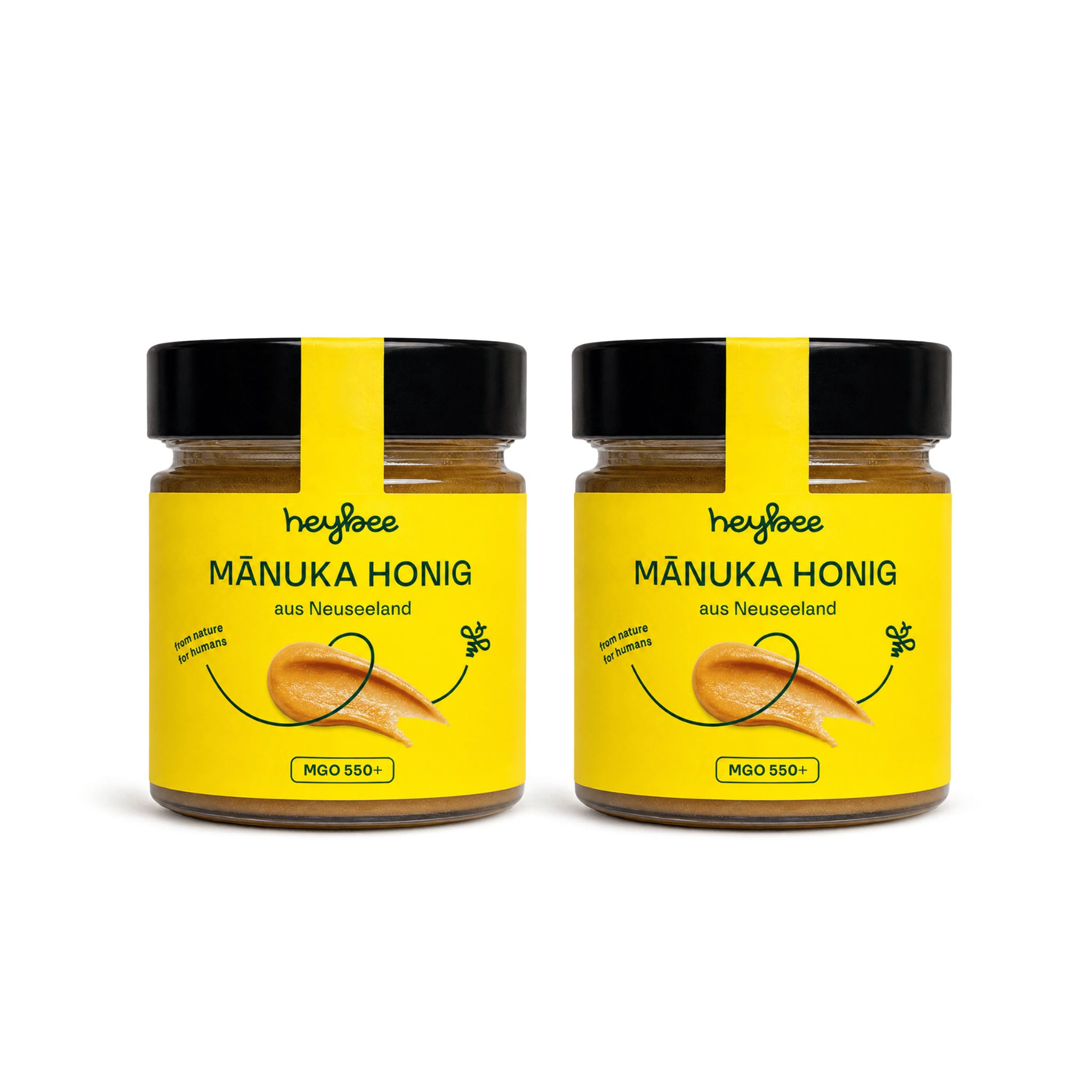 Zwei Gläser Manuka Honig nebeneinander, gelbe Etiketten.