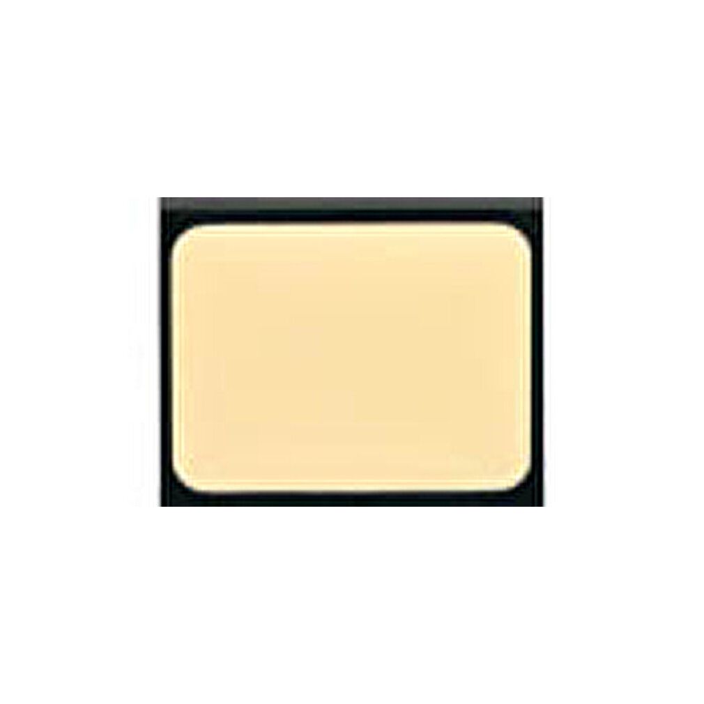 Kompakter, rechteckiger Camouflage-Creme-Korrektor in einem schwarzen Gehäuse. Die Creme ist hellbeige.