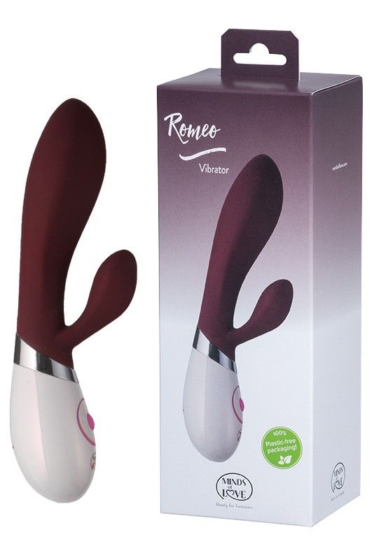 Weiß-roter Vibrator mit geschwungener Form und Verpackung. Auf der Verpackung steht "Romeo Vibrator".