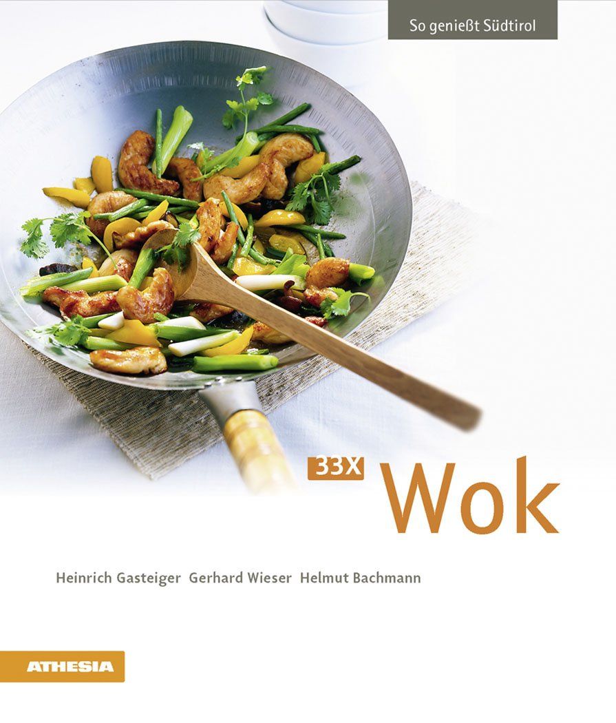 Kochbuch mit dem Titel "33 x Wok". Auf dem Cover ein Wok mit Gemüse und Fleisch. Autoren: Heinrich Gasteiger, Gerhard Wieser, Helmut Bachmann.
