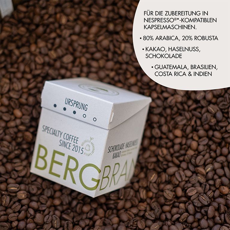 Kaffeebohnen und Verpackung. Aufschrift: BERGBRAND, Ursprung, Specialty Coffee. Text: 80% Arabica, 20% Robusta, Kakao, Haselnuss, Schokolade.