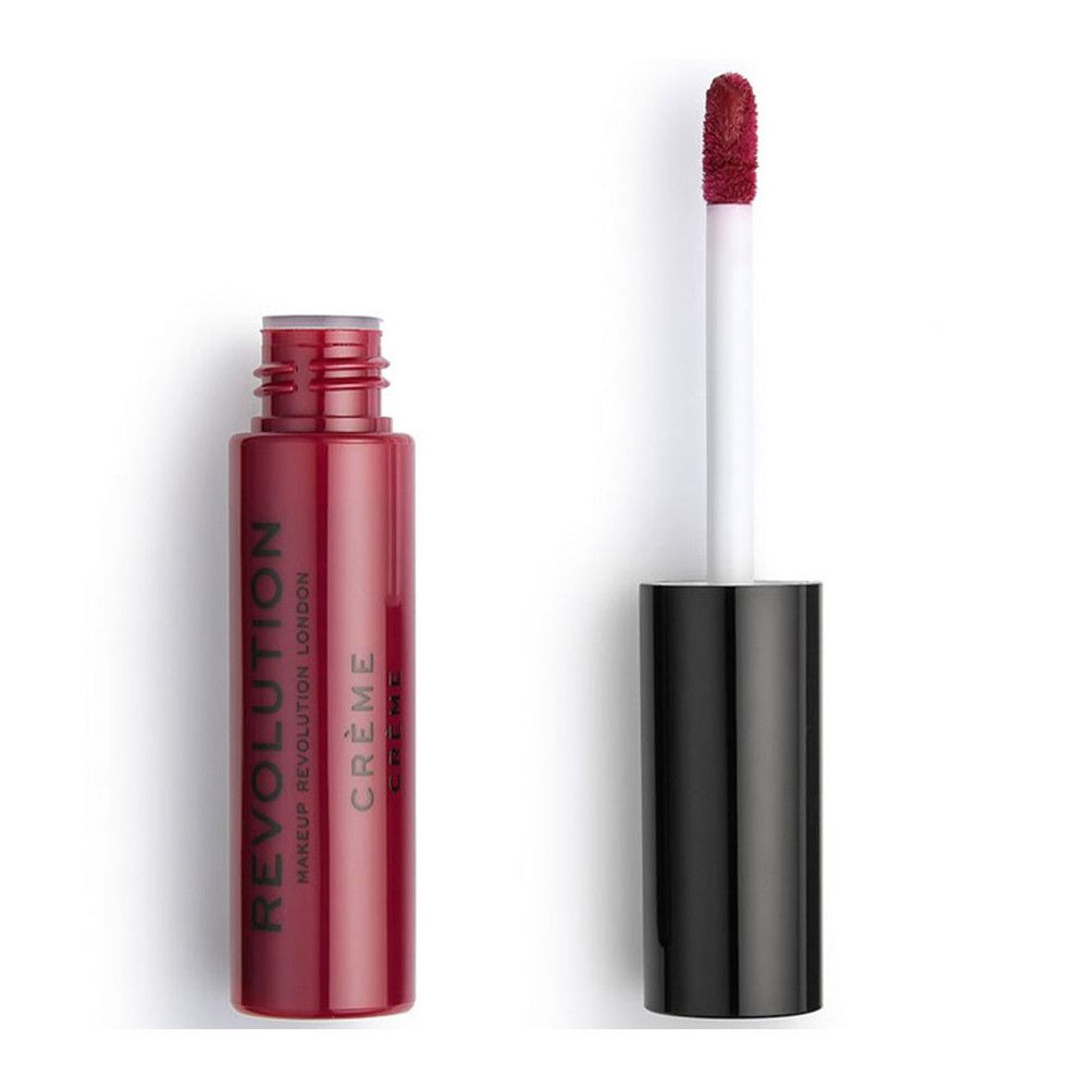 Roter Creme Lippenstift, Flasche geöffnet, Applikator daneben. Auf der Flasche steht "REVOLUTION LONDON CRÈME".
