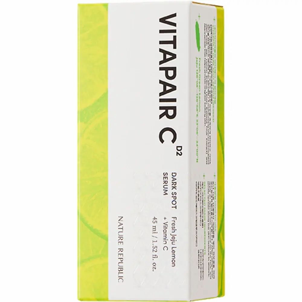 Weiße Schachtel mit gelben und grünen Akzenten. Beschriftung: VITAPAIR C, Dark Spot Serum, NATURE REPUBLIC.