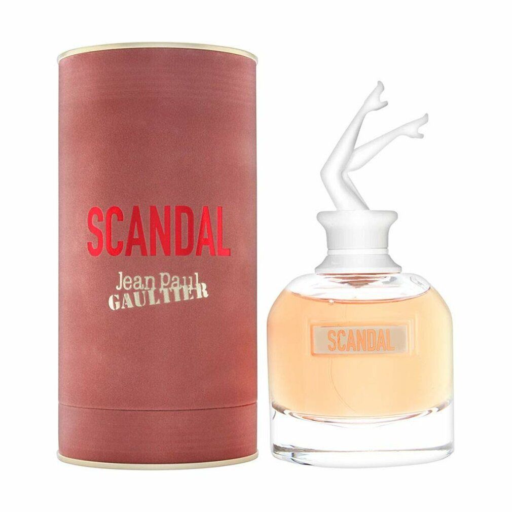 Parfümflakon mit weißem Bein-Deckel und zylindrischer Verpackung. Aufschrift "SCANDAL" und "Jean Paul Gaultier".