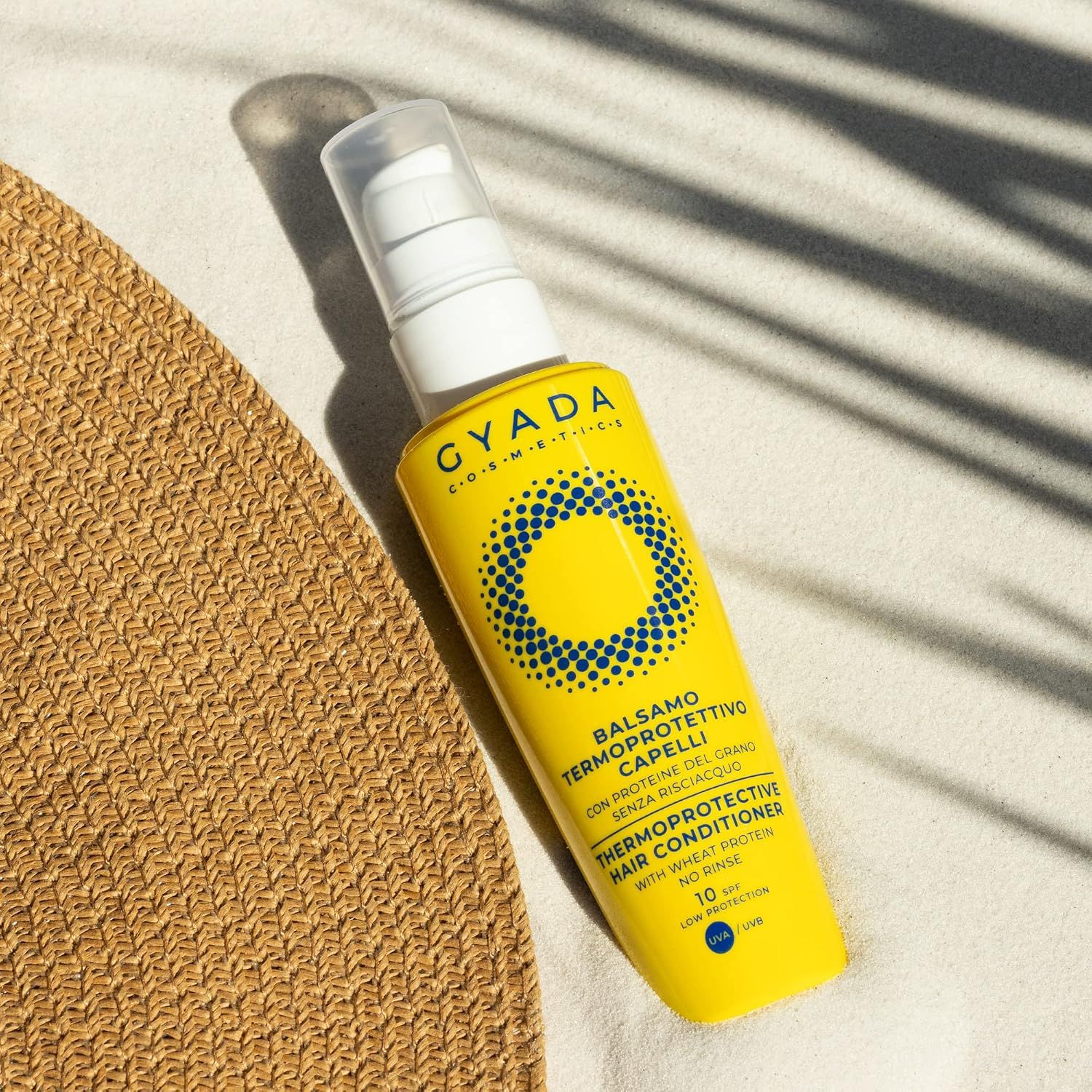 Gelbe Sprühflasche "GYADA" Thermoprotective Hair Conditioner mit Pumpspender.