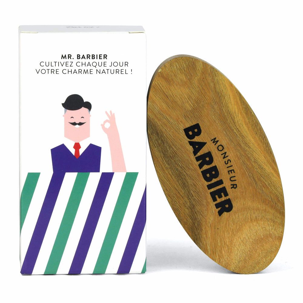 Bartbürste aus Sandelholz mit schwarzem Borstenfeld. Verpackung mit Logo und Illustration.
