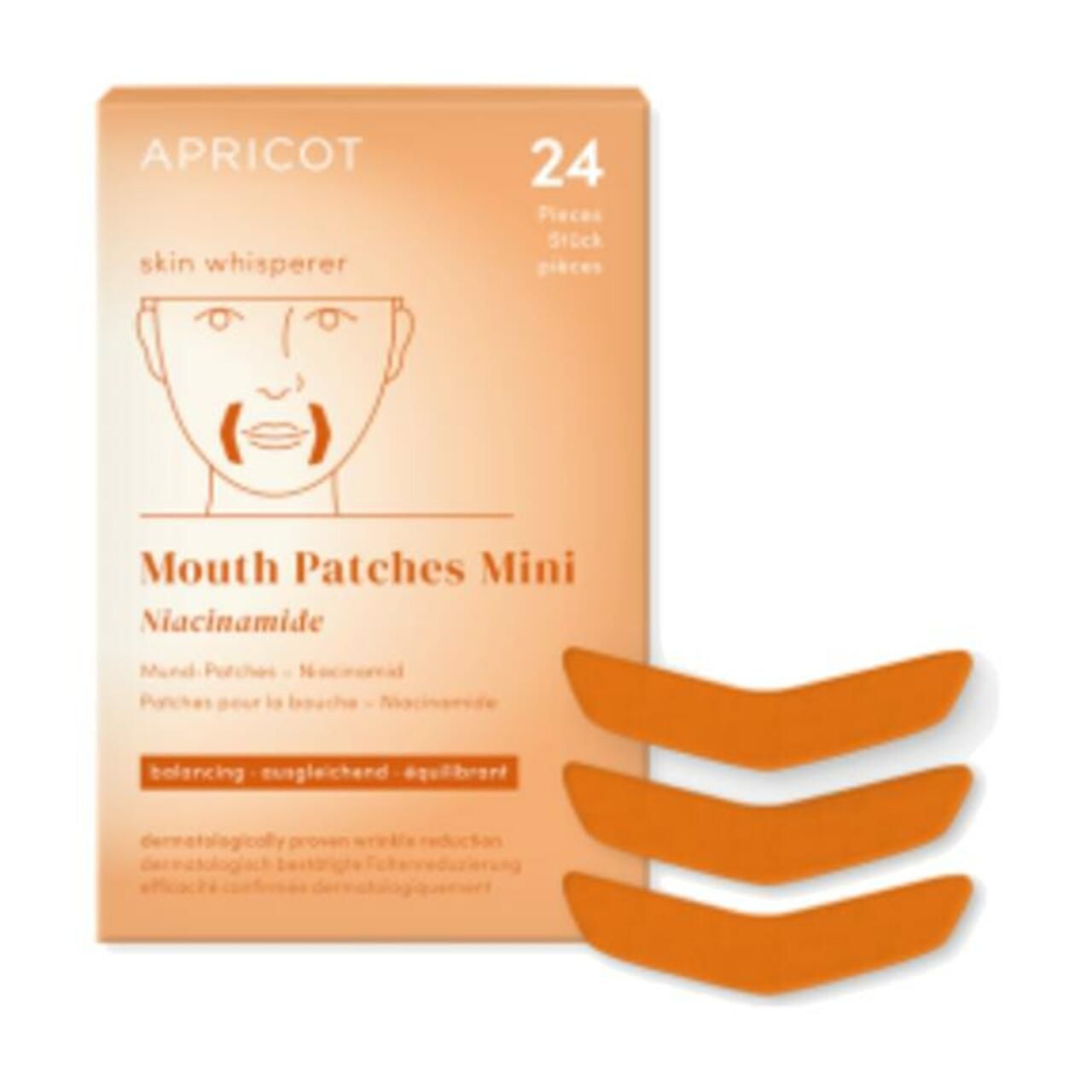 Verpackung von APRICOT Mund Patches Mini mit Niacinamid. 24 Stück. Orangefarbene Patches liegen daneben.