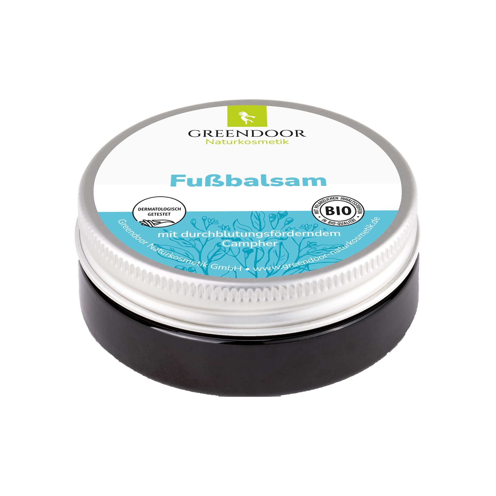 Runde Dose mit silbernem Deckel und schwarzem Boden. Auf dem Deckel steht "Fußbalsam". Logo und Bio-Siegel sind ebenfalls sichtbar.