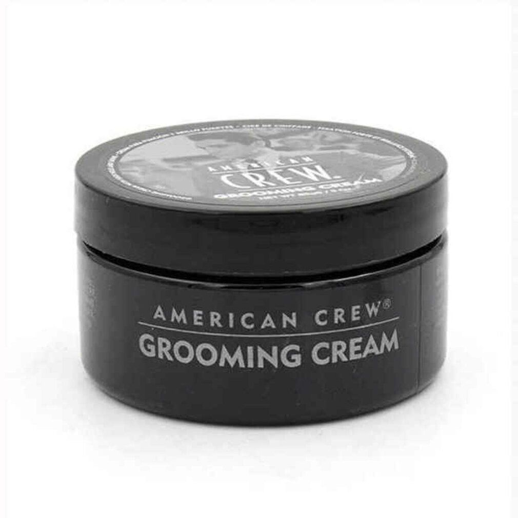 Schwarze Dose American Crew Grooming Cream. Weißer Text auf dem Behälter. Deckel mit Bild und Text.