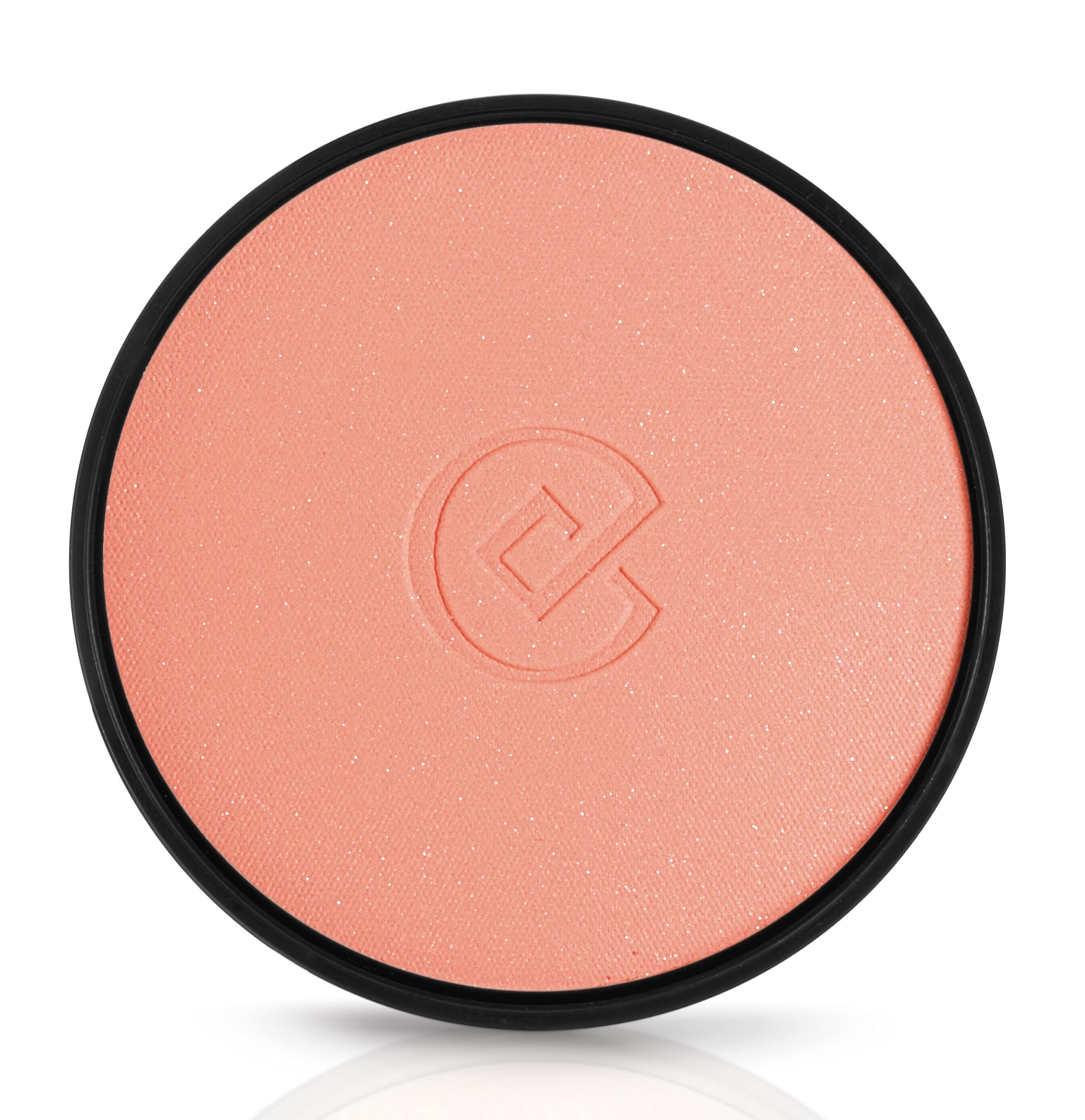 Runder, rosafarbener Kompaktpuder mit schwarzem Rand. Geprägtes Logo in der Mitte.