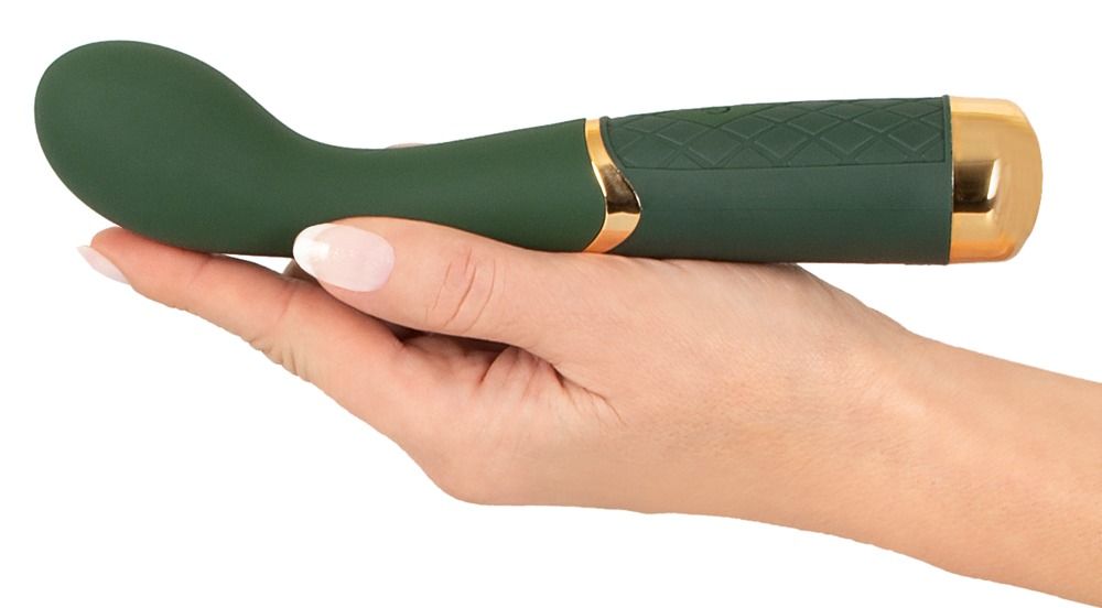 Grüner Vibrator, goldfarbene Akzente, in Hand gehalten. Geformter Kopf, geriffelter Griff. Goldfarbene Enden.