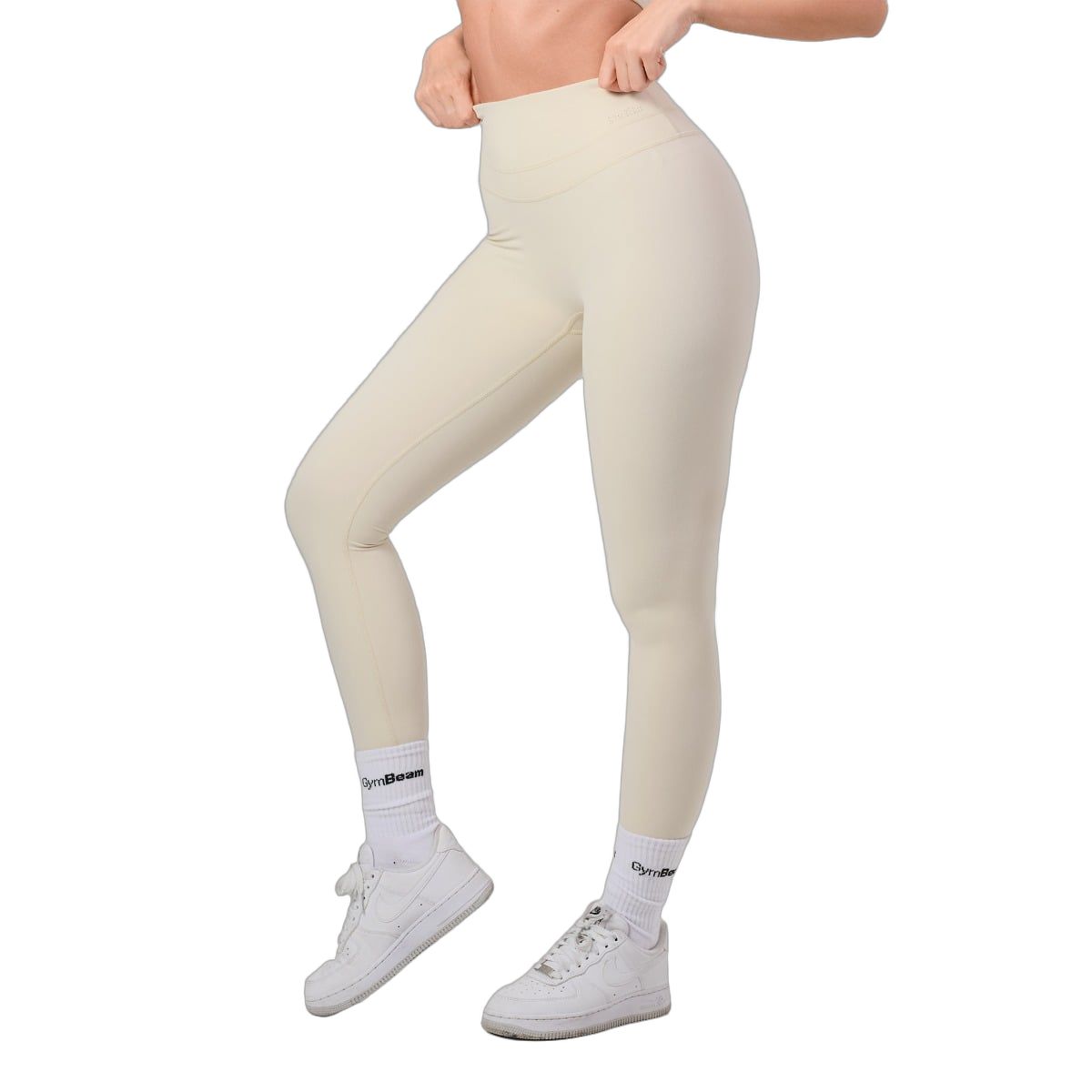 Damen-Leggings in hellem Beige, hohe Taille, nahtlos, seitliche Ansicht.