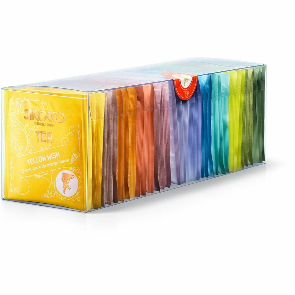 Transparente Box mit Teebeuteln in verschiedenen Farben. Auf der Vorderseite gelbes Etikett mit Logo und Text. Siegel mit rotem Logo.
