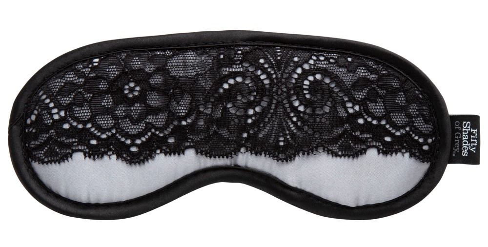 Satin-Augenmaske mit schwarzer Spitze. Schwarzer Rand. Label mit "Fifty Shades of Grey".