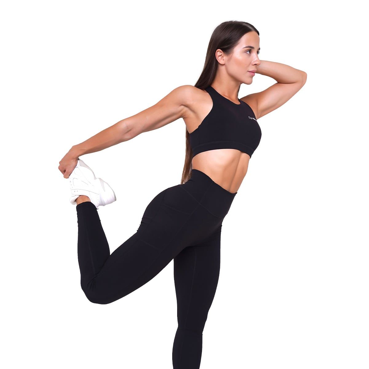 Frau in schwarzen Leggings mit hoher Taille und Sport-BH, dehnt sich.