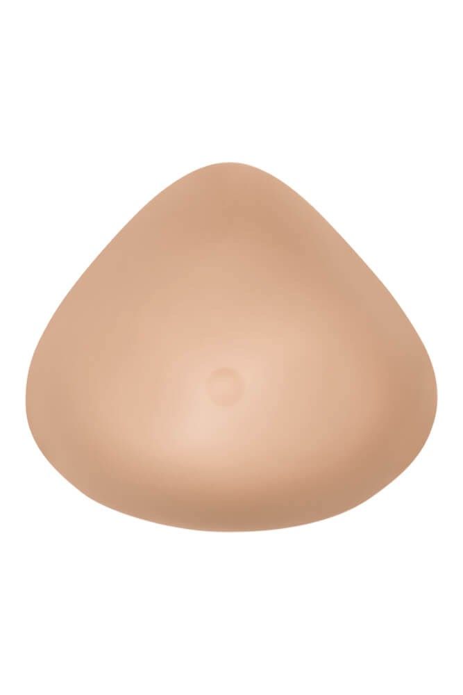 Brustprothese, hautfarben, tropfenförmig. Mit leichtem, zentralem Punkt.