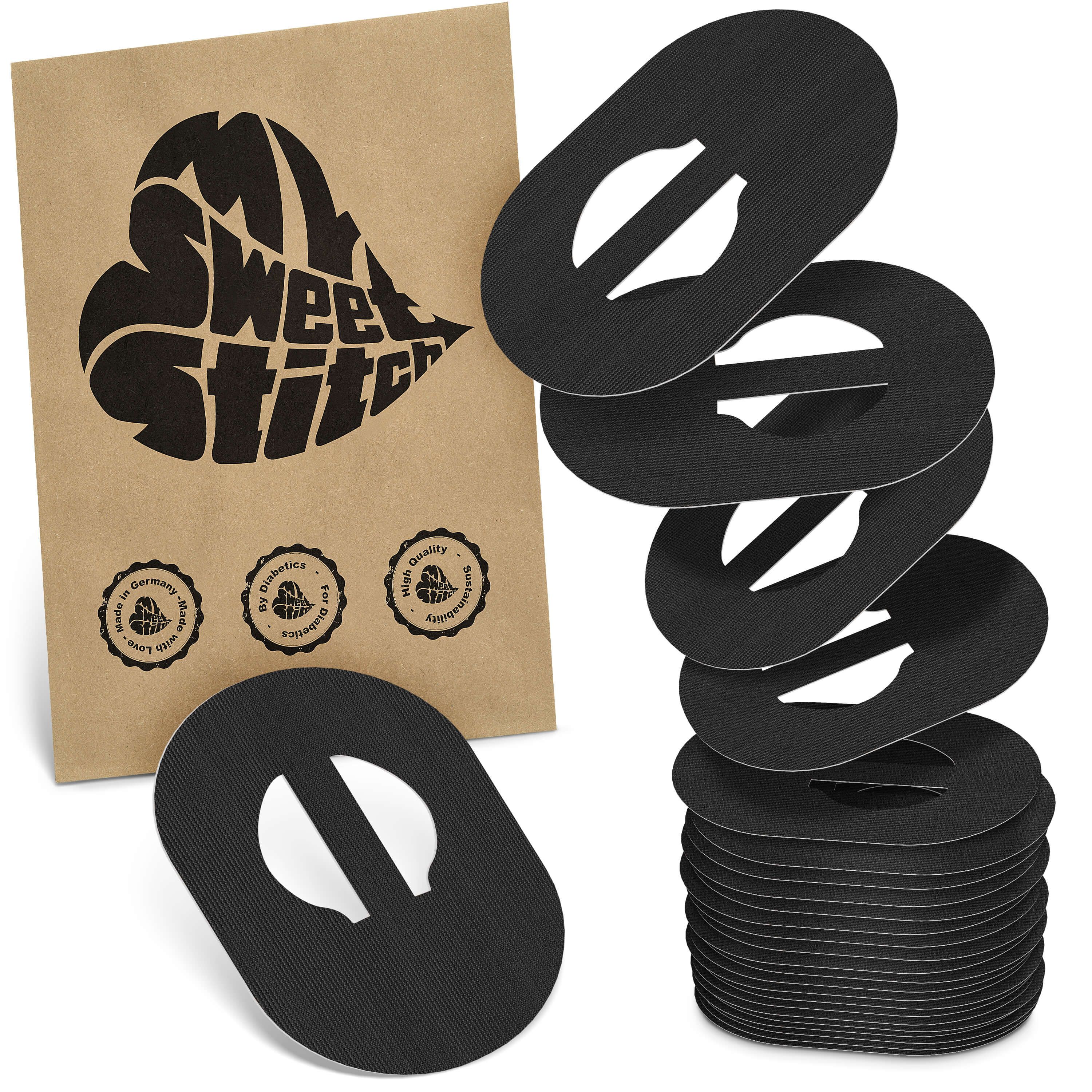 Braune Verpackung mit Logo und mehreren schwarzen, ovalen Pflastern mit Aussparung. Stapel und einzelne Pflaster.