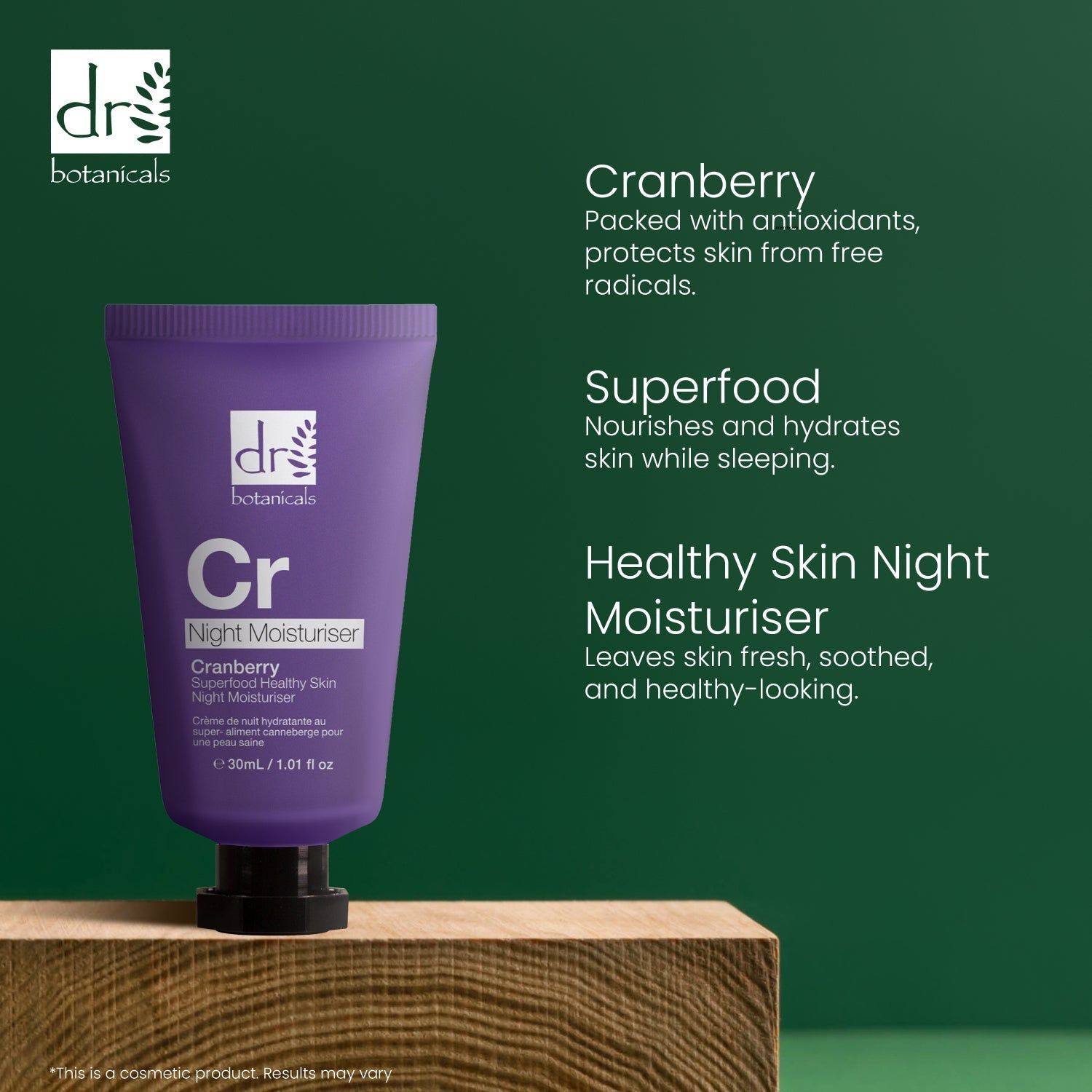 Lila Tube auf Holzblock. Text: Cranberry, Superfood, Healthy Skin Night Moisturiser. Dr Botanicals, Cr, Night Moisturiser, Cranberry Superfood Healthy Skin.
