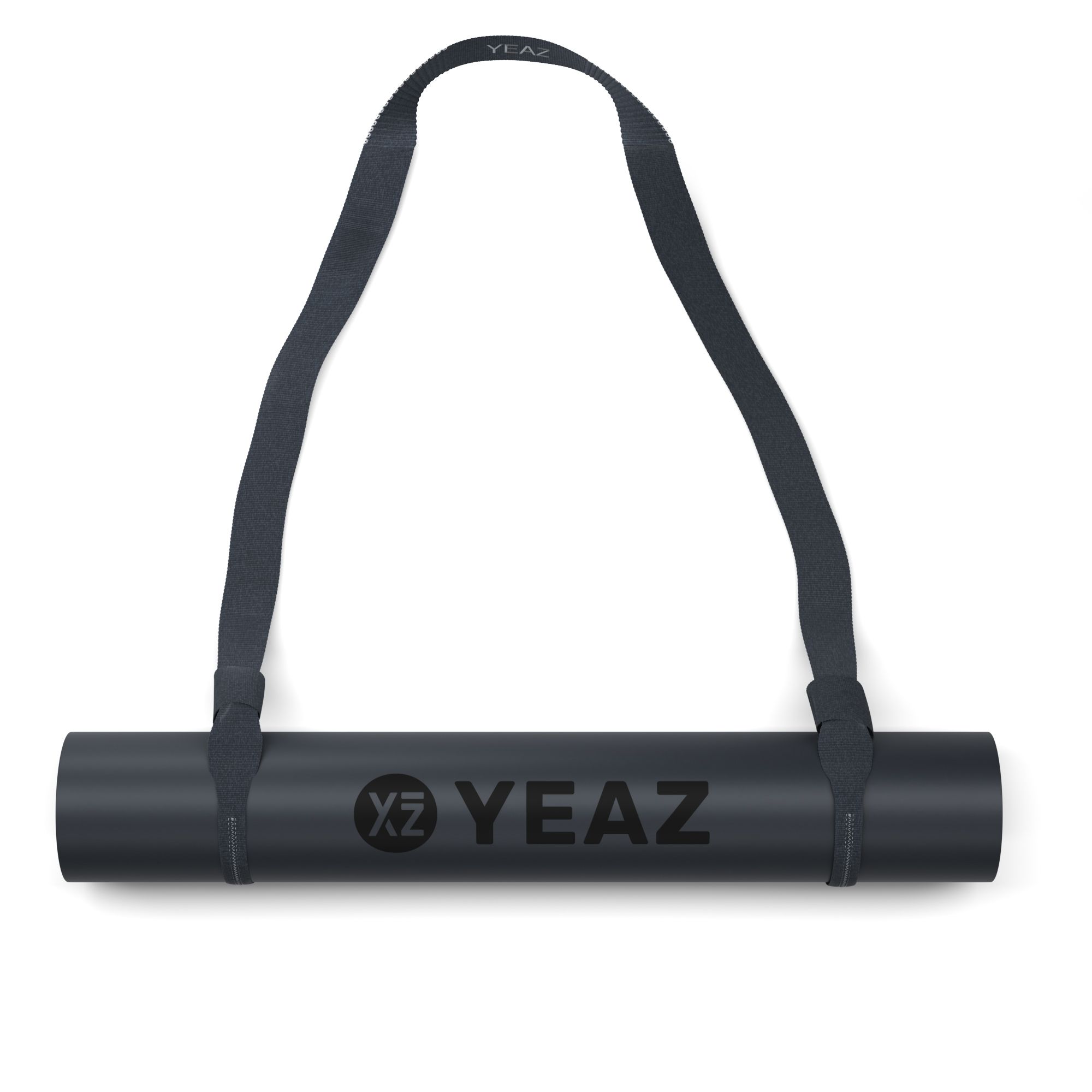 Gerollte Yogamatte mit Tragegurt. Schwarze Matte mit YEAZ-Logo. Gurt zum Tragen.