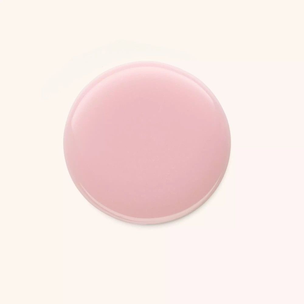 Rosa Nagellack auf hellem Hintergrund. Runde Form.