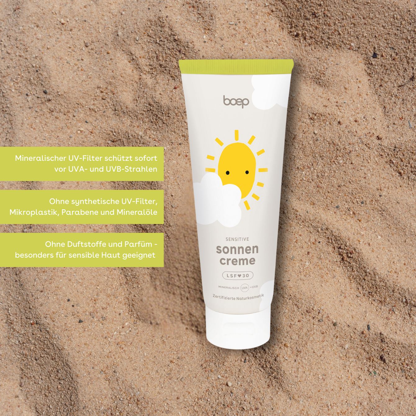 Sonnencreme-Tube, weiß mit gelbem Deckel. Aufdruck: Sonne, Wolken, "sonnen creme sensitiv LSF 30".