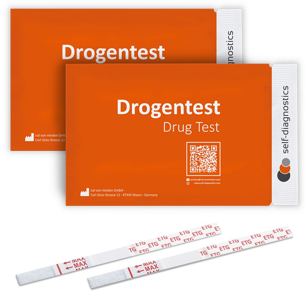 Zwei orangefarbene Verpackungen mit dem Aufdruck "Drogentest". Darunter Teststreifen mit roten Markierungen.