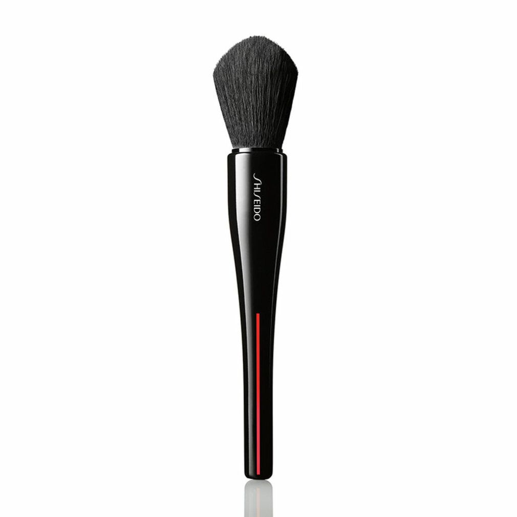 Pinsel mit schwarzem Borstenkopf und schwarzem Griff mit rotem Streifen. SHISEIDO-Logo auf dem Griff.