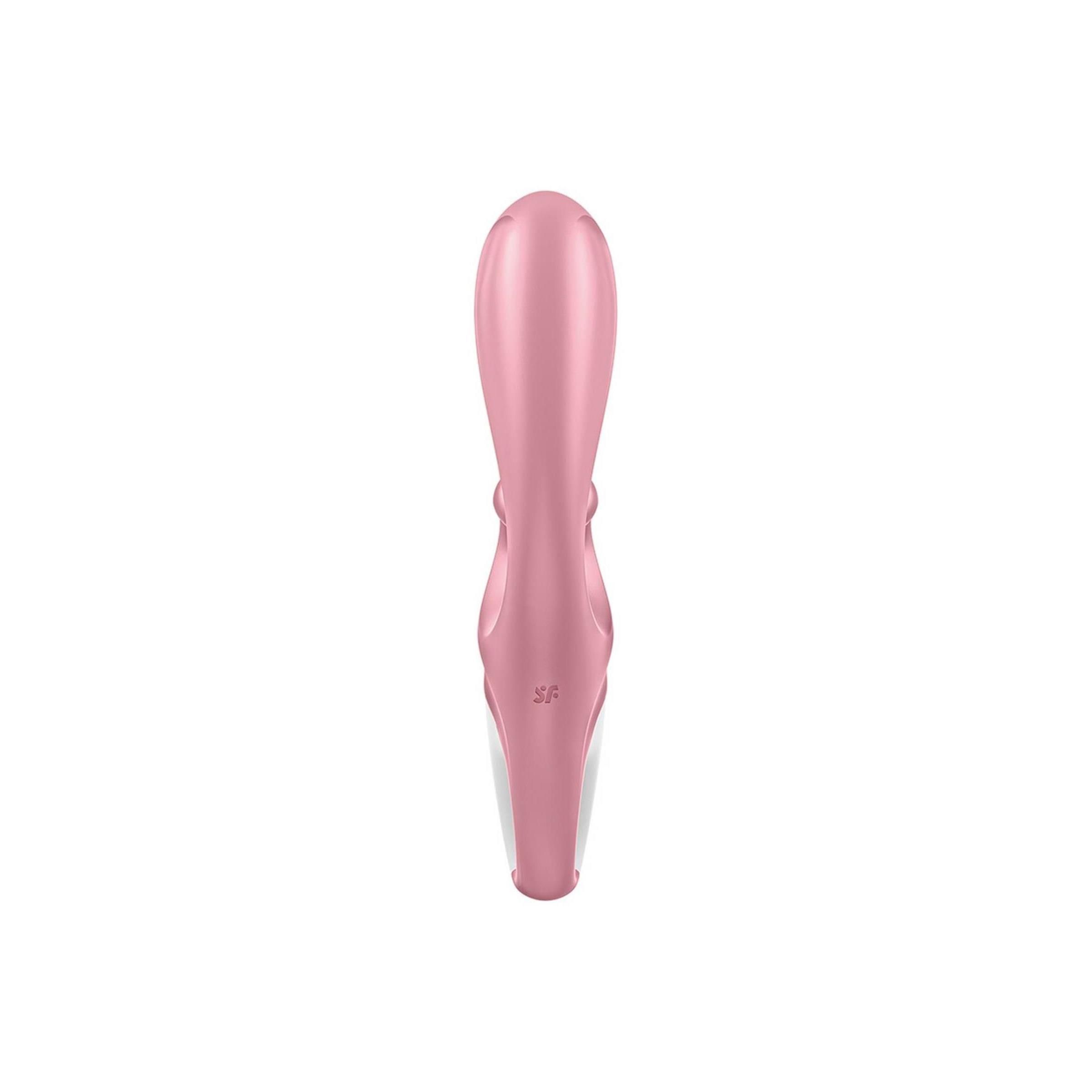 Rosa Vibrator, Ansicht von unten. Weißer Bereich mit Bedienelementen. Zungenförmiger Aufsatz.