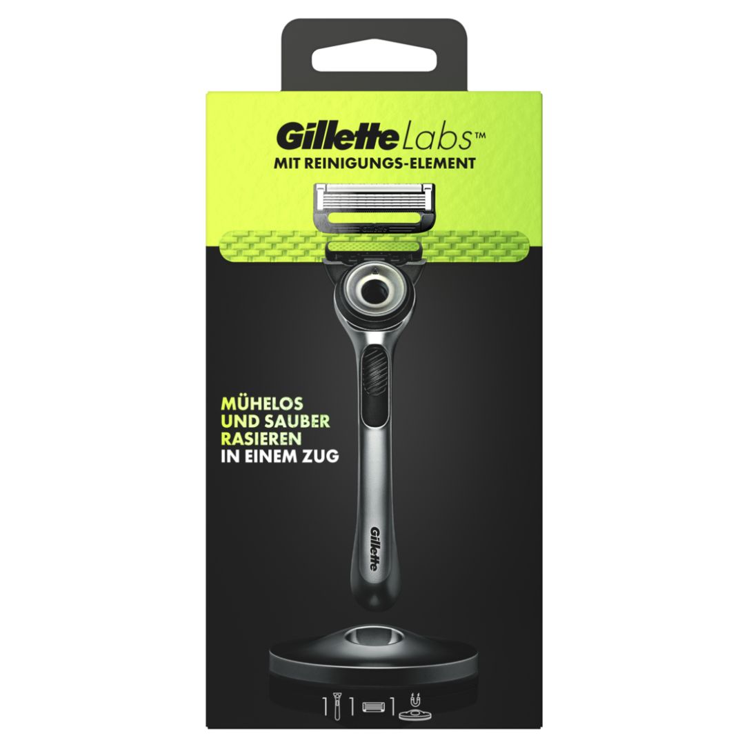 Rasierer in Verpackung. Text: Gillette Labs, mit Reinigungs-Element, mühelos rasieren. Schwarzer Hintergrund.