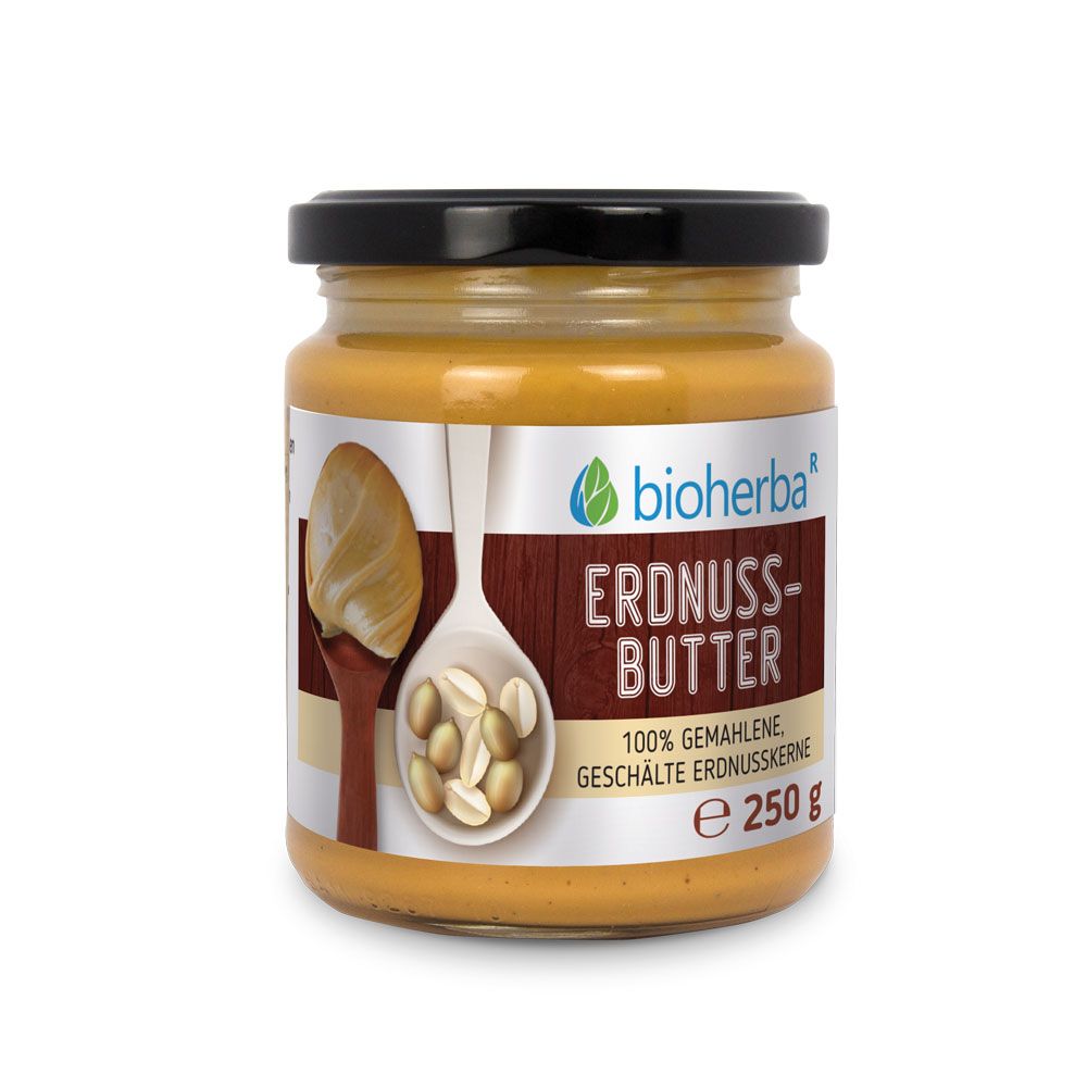 Glas mit Erdnussbutter und schwarzem Deckel. Logo: Bioherba. Produktname: Erdnuss-Butter. 100% gemahlene, geschälte Erdnusskerne. Inhalt: 250 g.