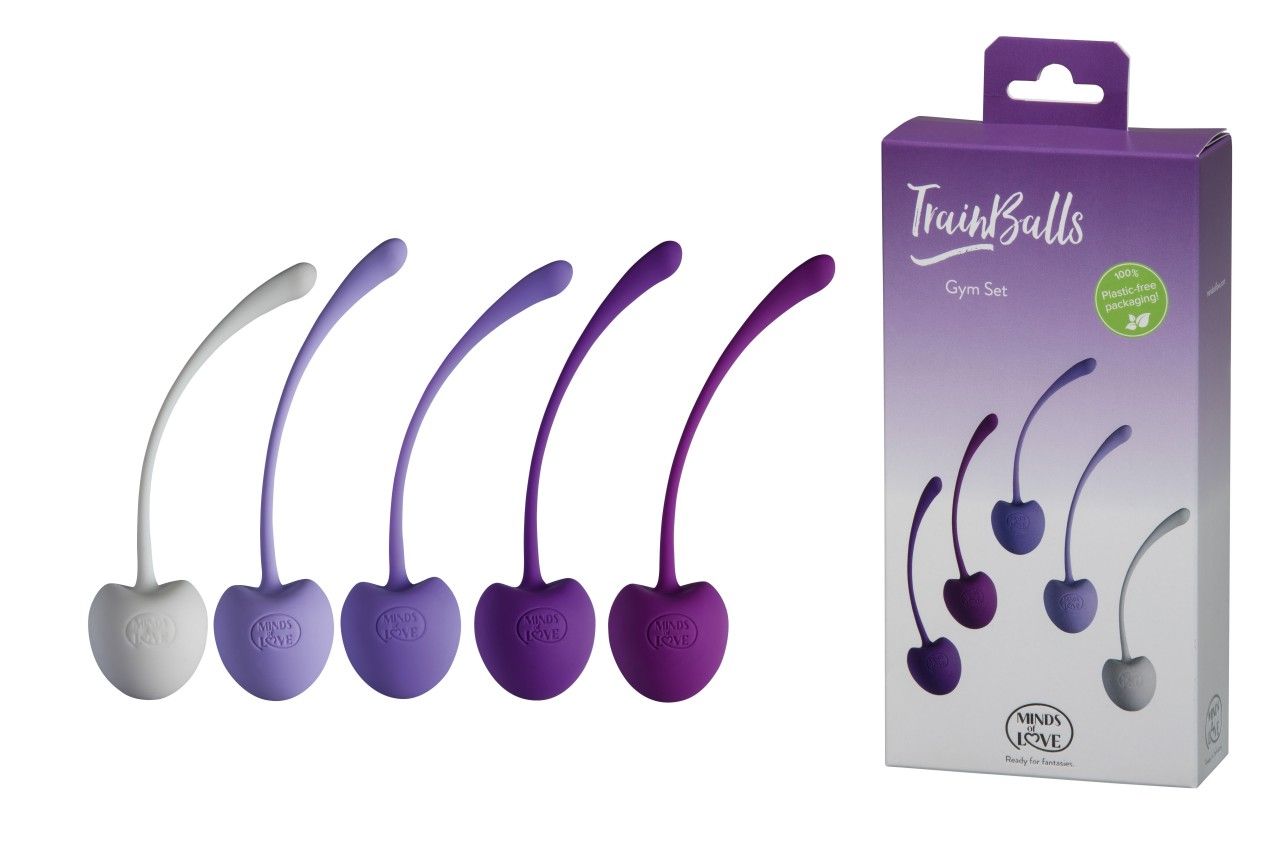 Fünf Kegel-Trainingsbälle in verschiedenen Lilatönen und Grau mit flexiblen Stielen. Verpackung zeigt das Produkt.