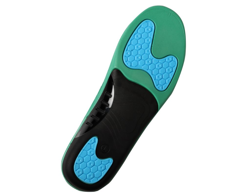 Unterseite der Einlegesohle. Grün mit schwarzen und blauen Bereichen. Wabenmuster.