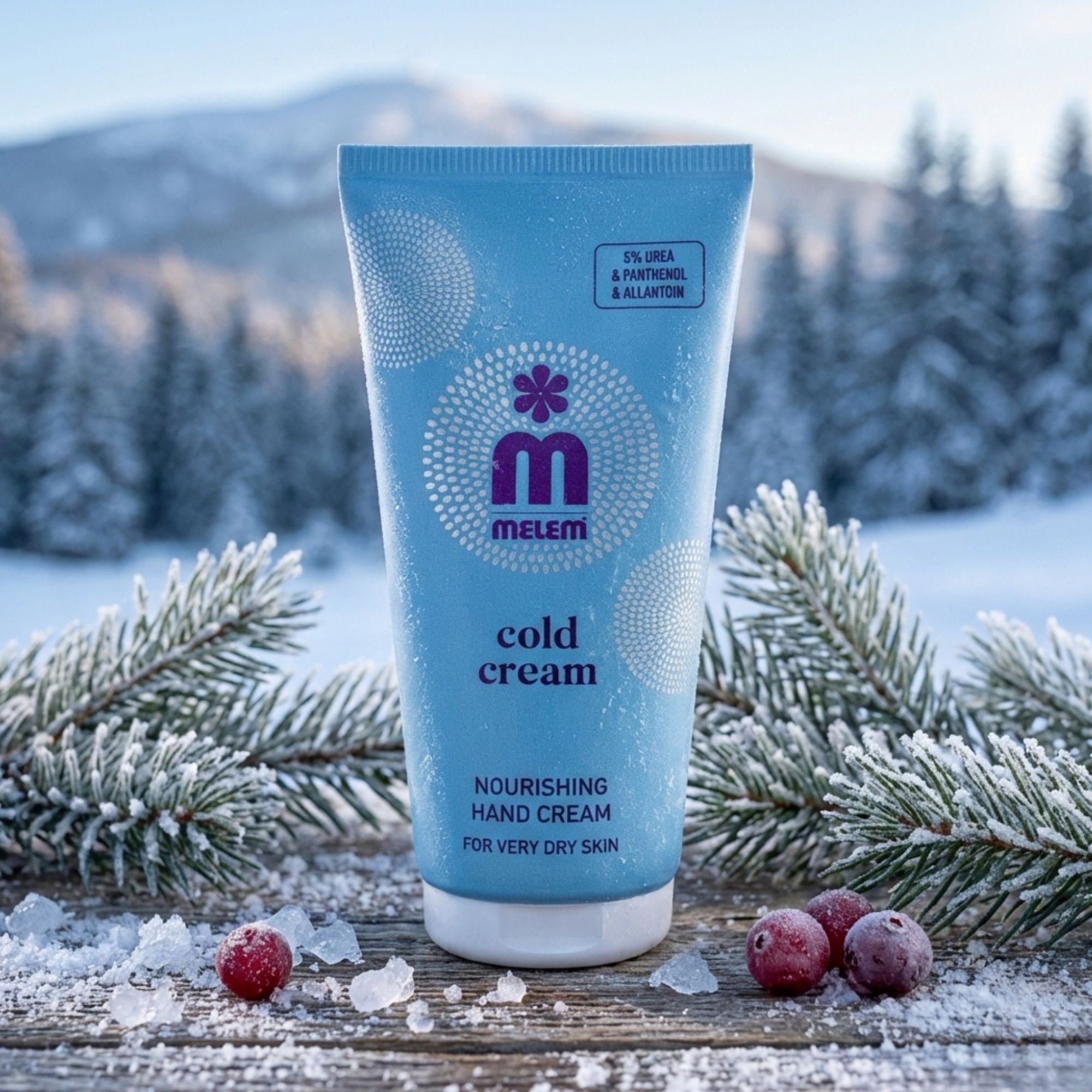Hellblaue Tube mit "Melem Cold Cream". Aufschrift: "Nourishing Hand Cream for very dry skin". Hintergrund: verschneite Landschaft.