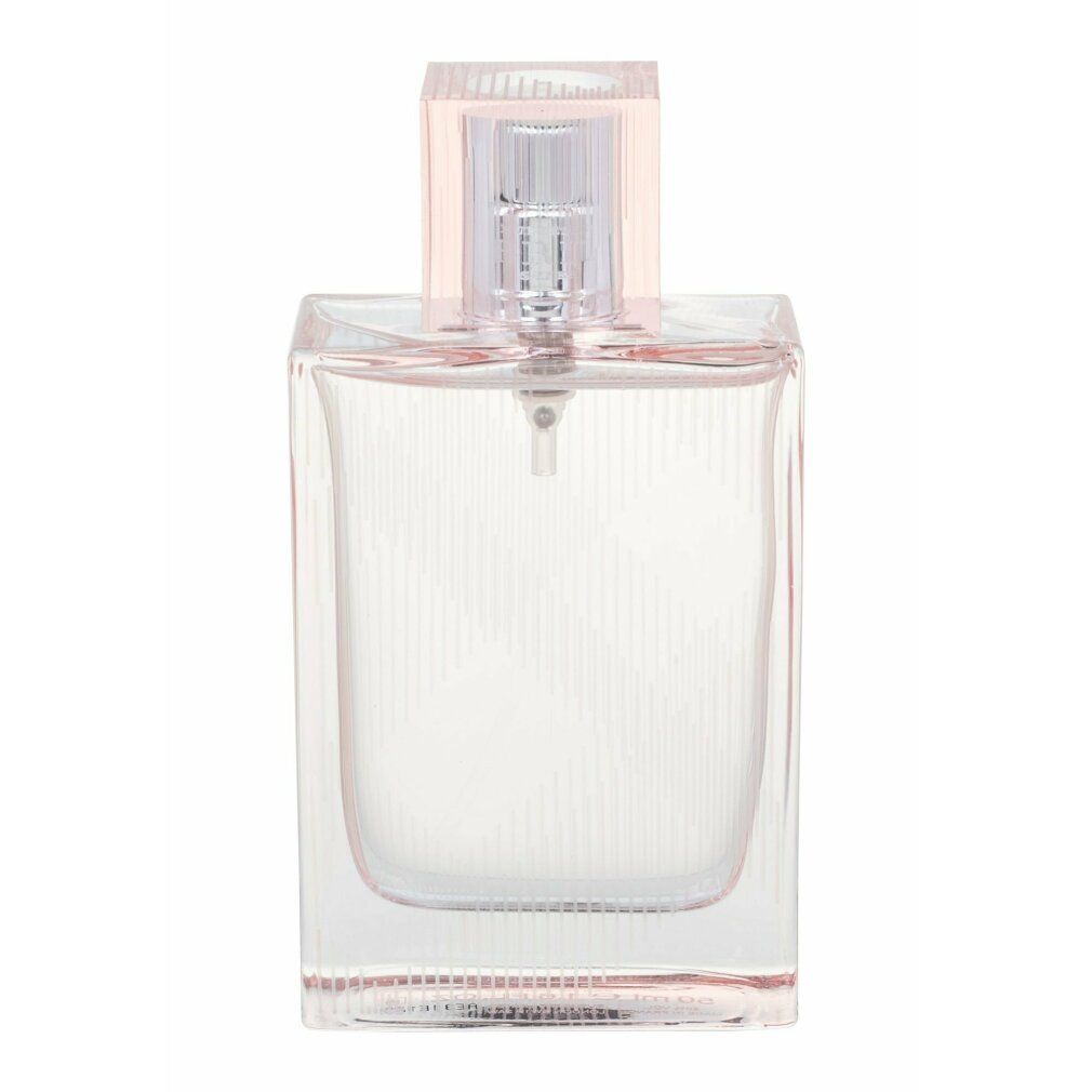 Rechteckige Glasflasche mit transparentem Parfüm und einem silbernen Sprühkopf unter einem rosa transparenten Deckel.