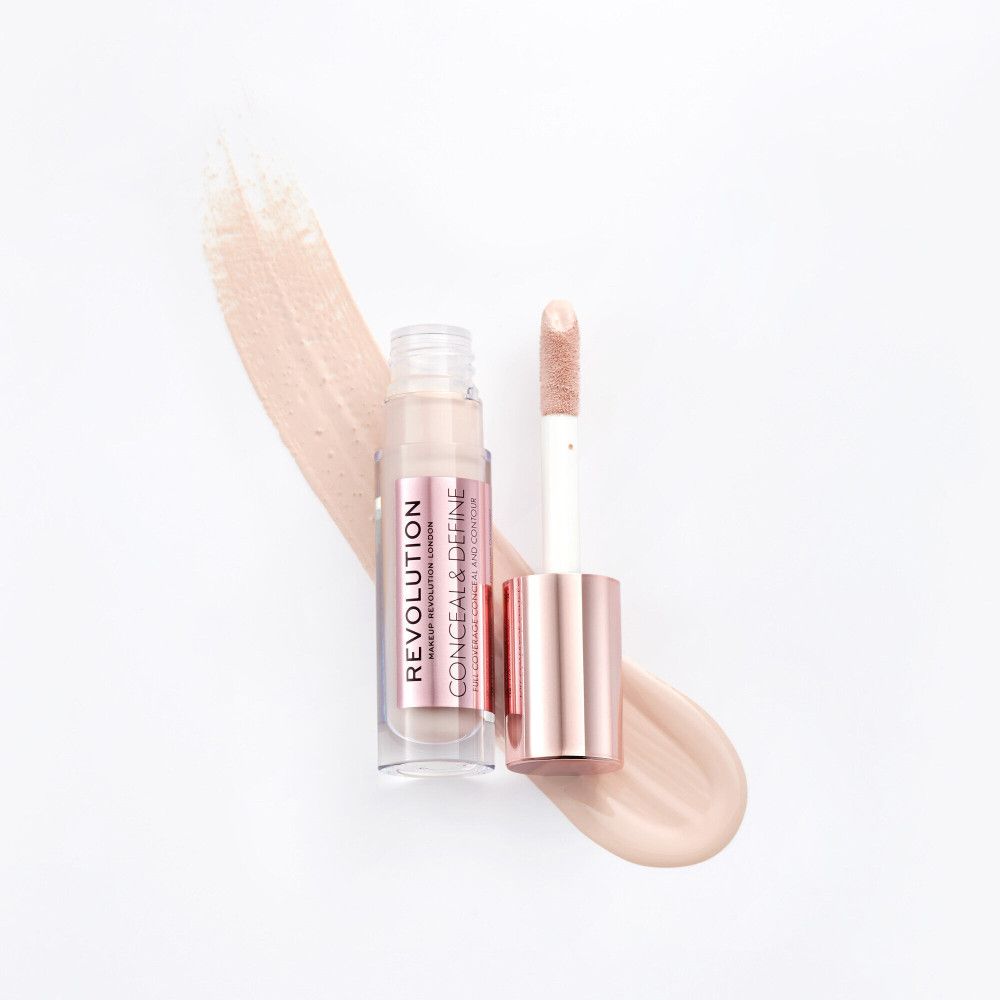 Concealer-Fläschchen mit Applikator. Rosa-goldene Kappe, transparente Flasche. Produktname und Text auf dem Etikett.