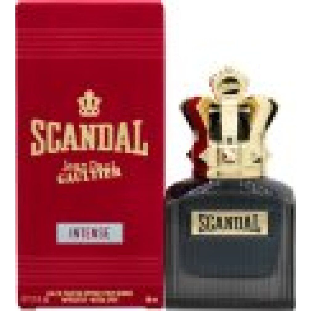 Dunkelblauer Flakon und rote Verpackung. Flakon mit goldfarbenem Kronenverschluss. Aufschrift "SCANDAL".