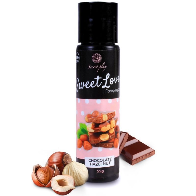 Flasche mit Schokoladen-Haselnuss-Gelee, Schokoladenriegel und Haselnüssen.