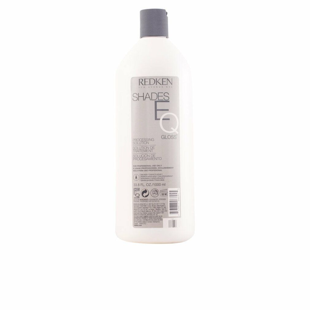 Weiße Flasche mit grauem Deckel. Aufschrift: Redken Shades EQ Gloss. Etikett mit Produktinformationen.