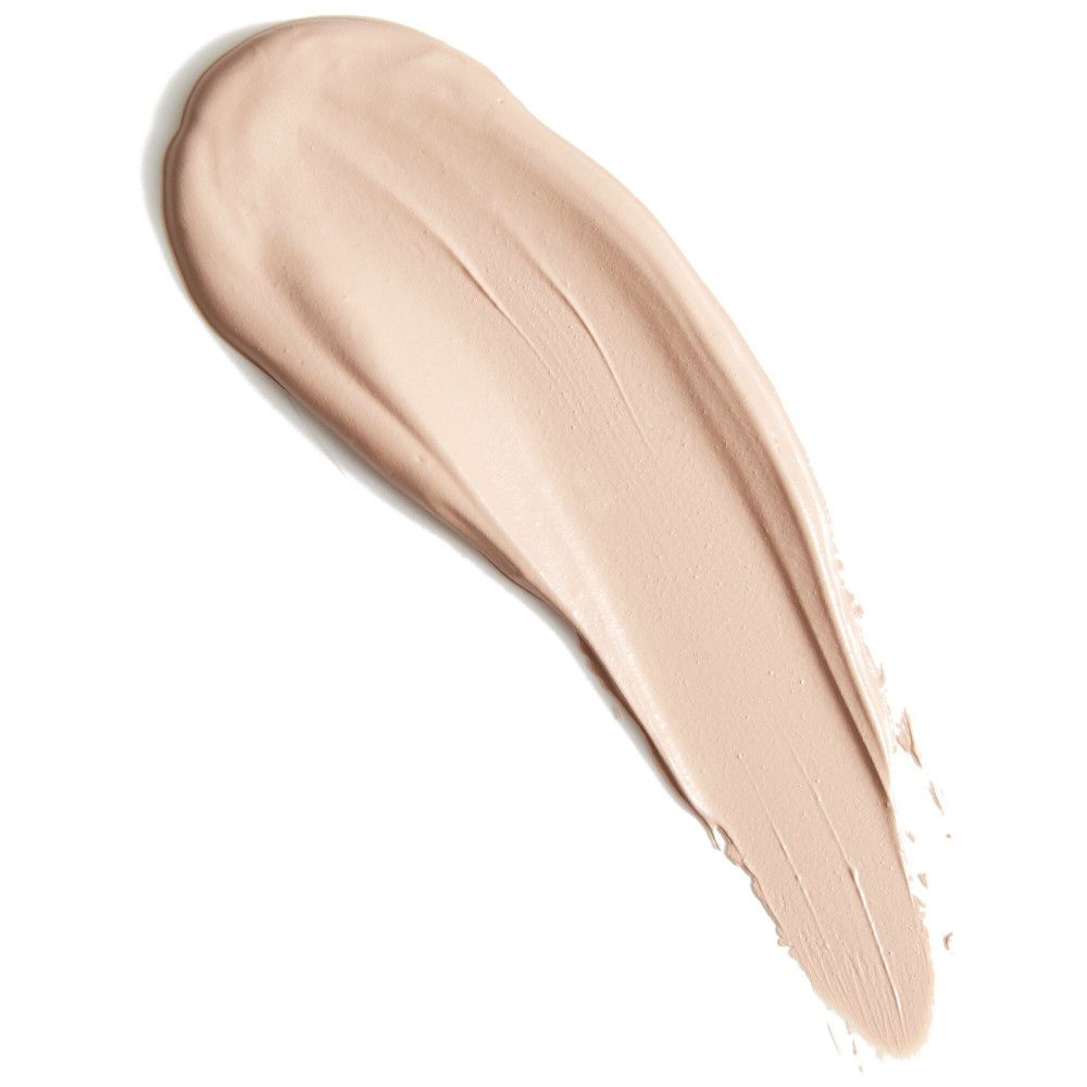 Heller Concealer-Farbton als Strich. Textur mit sichtbaren Pinselstrichen. Auf weißem Hintergrund.