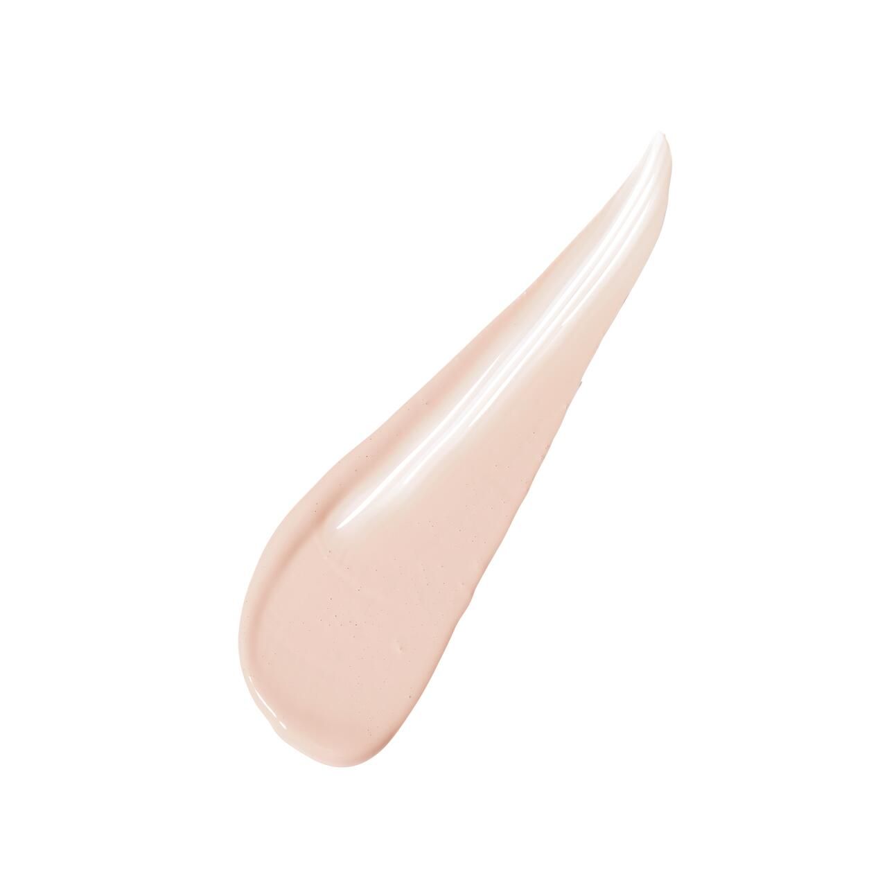 Heller Concealer-Strich auf weißem Hintergrund. Creme-Textur, schräg verlaufend.