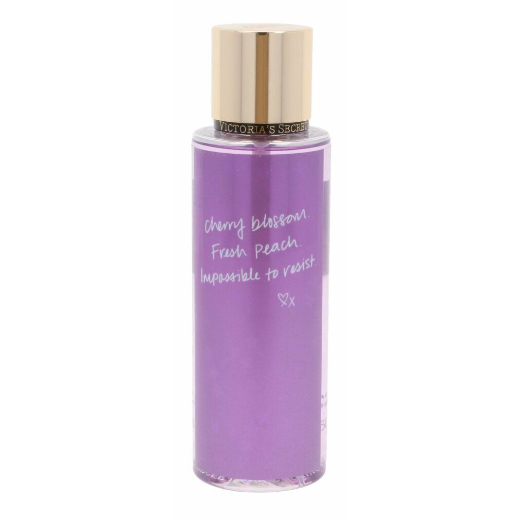 Körperspray mit goldfarbenem Deckel. Auf dem Etikett steht "Victoria's Secret Love Spell".